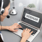 Webinar online, internet education, e-learning concept. Woman watching e-learning content on laptop